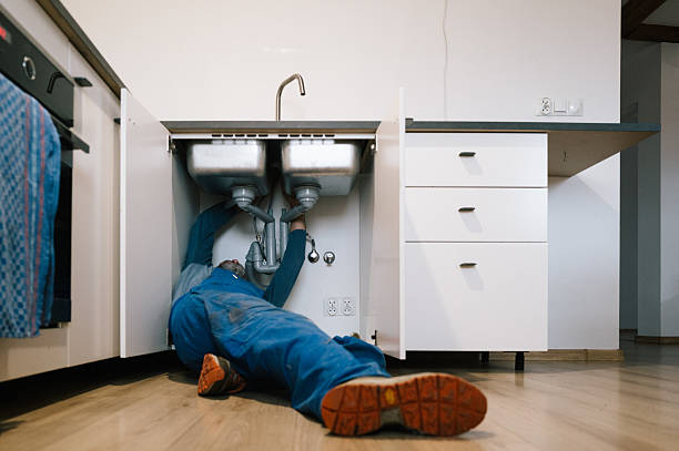 Professional Drain Cleaning technician working in Warren, AR